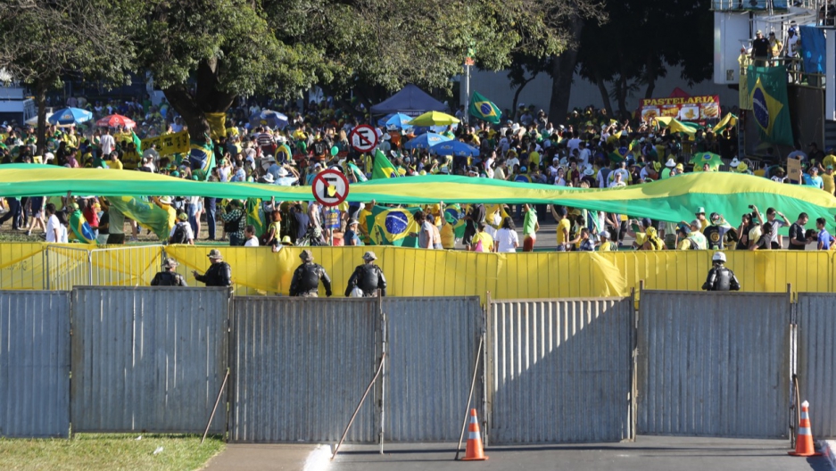 Authorities erected a fence to separate demonstrators for and against Rousseff's impeachment in Brasilia.